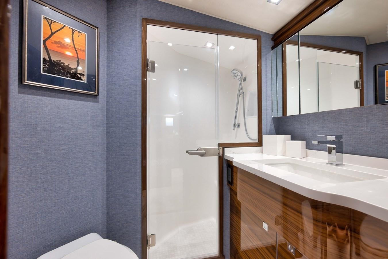 a bathroom with a sink and a shower aboard MISS CARRIE Yacht for Sale