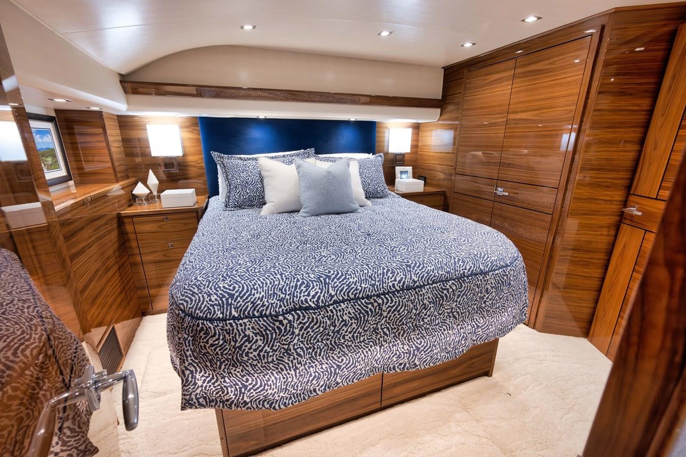 a bed in a room aboard MISS CARRIE Yacht for Sale