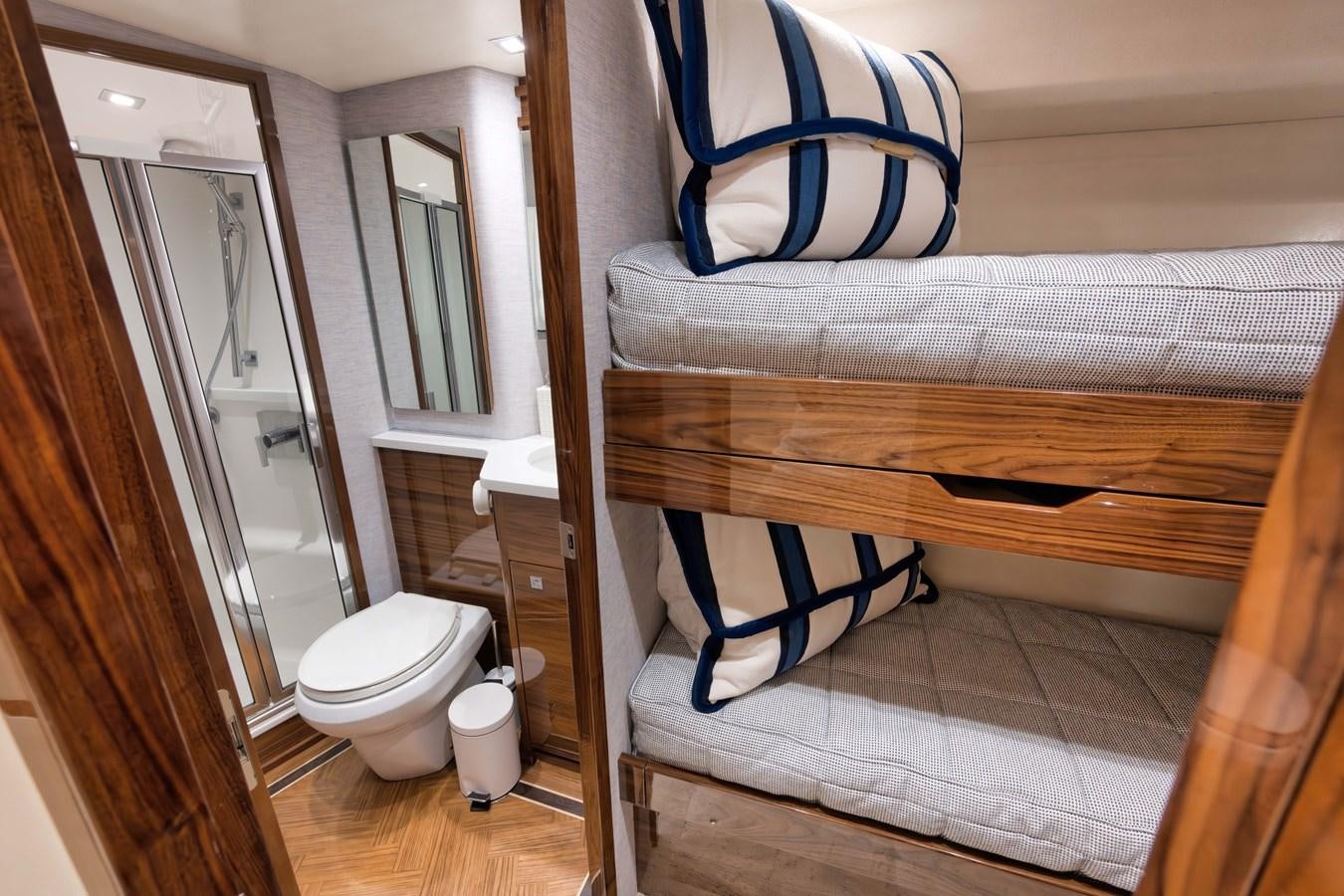 a small bathroom with a bed aboard MISS CARRIE Yacht for Sale