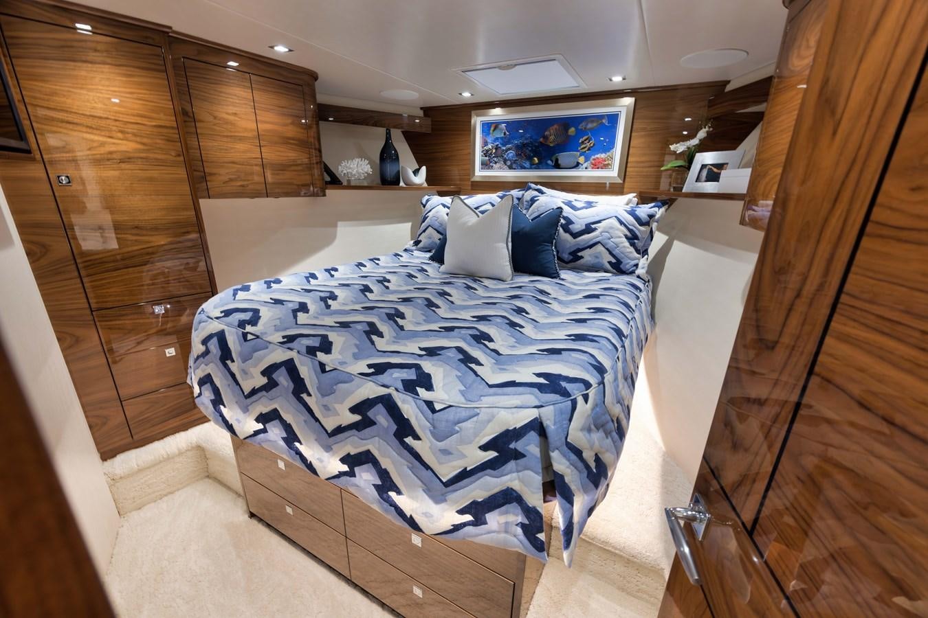 a bed in a room aboard MISS CARRIE Yacht for Sale