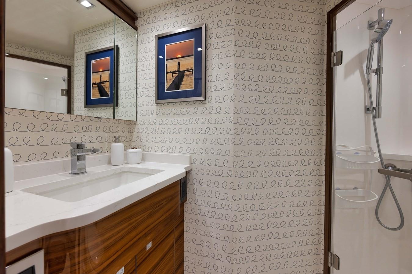 a bathroom with a shower unit and sink aboard MISS CARRIE Yacht for Sale