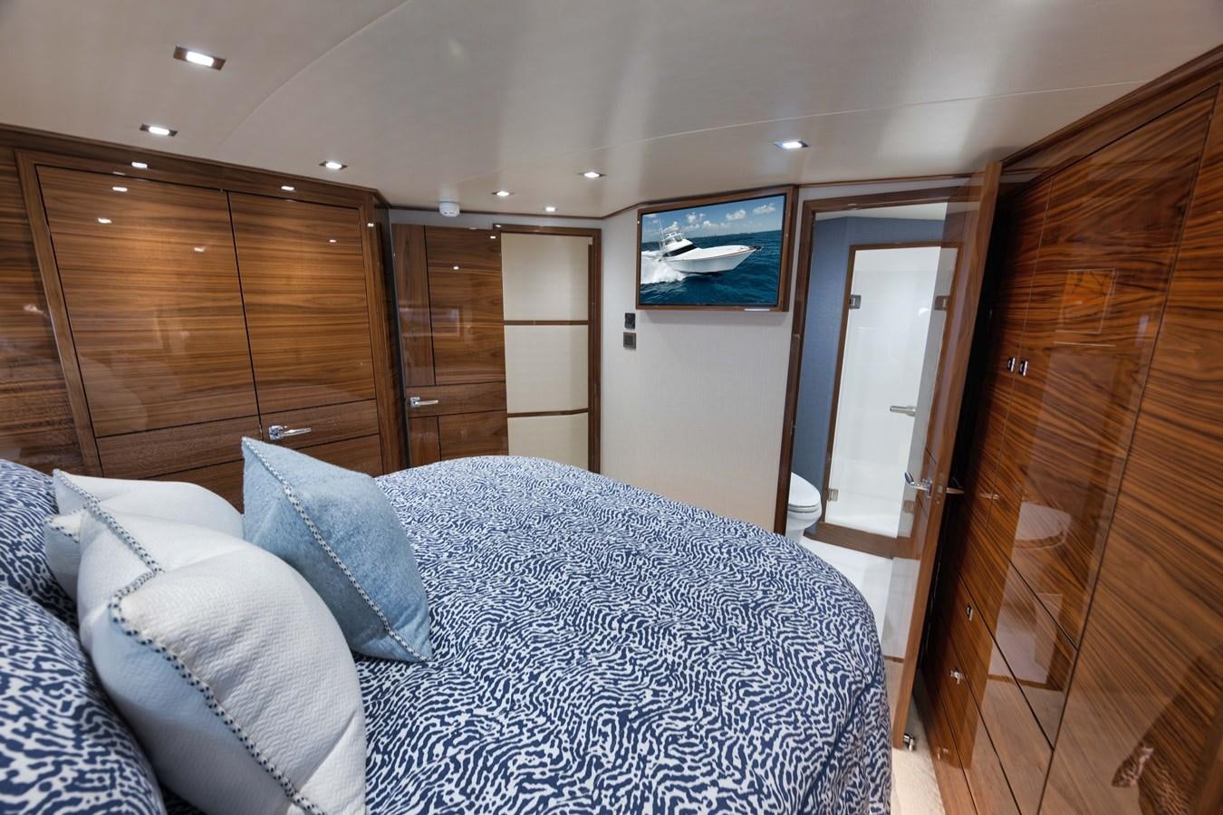 a bed in a room aboard MISS CARRIE Yacht for Sale