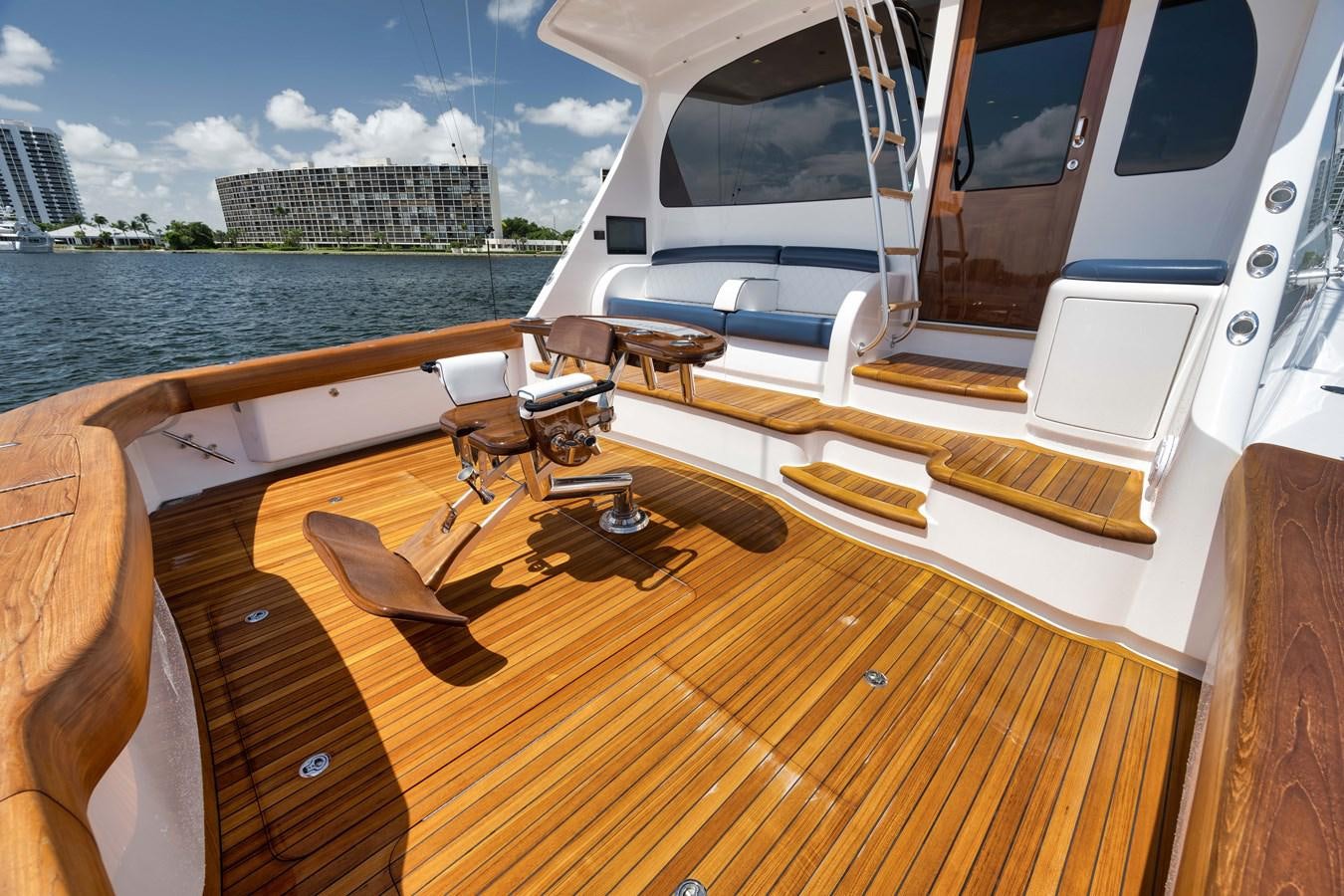 a deck with a view of the water and a city aboard MISS CARRIE Yacht for Sale