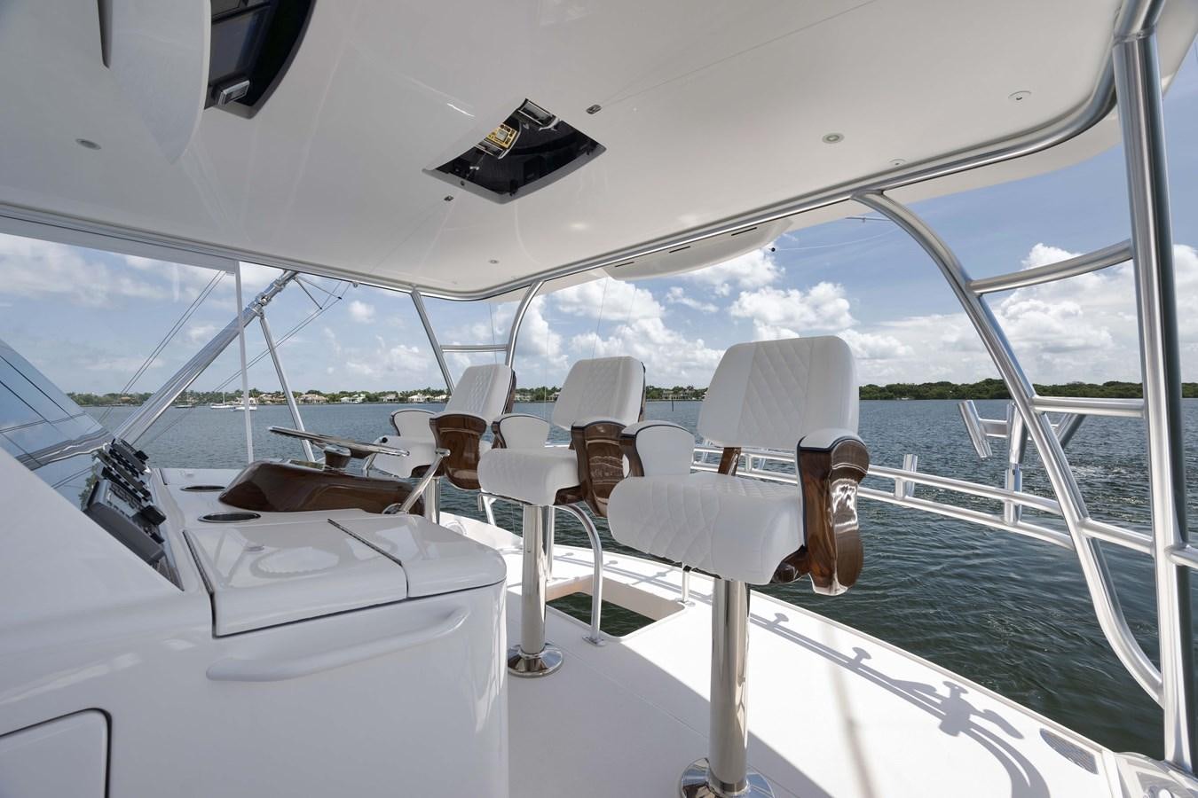 a room with a table and chairs aboard MISS CARRIE Yacht for Sale