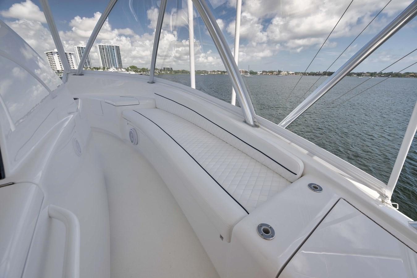 a white boat on the water aboard MISS CARRIE Yacht for Sale