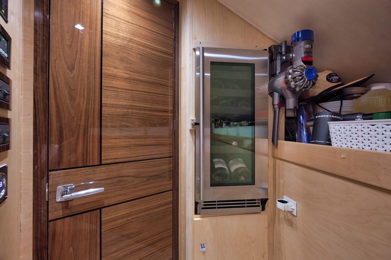 a cabinet with a sink and a shelf with objects on it aboard MISS CARRIE Yacht for Sale