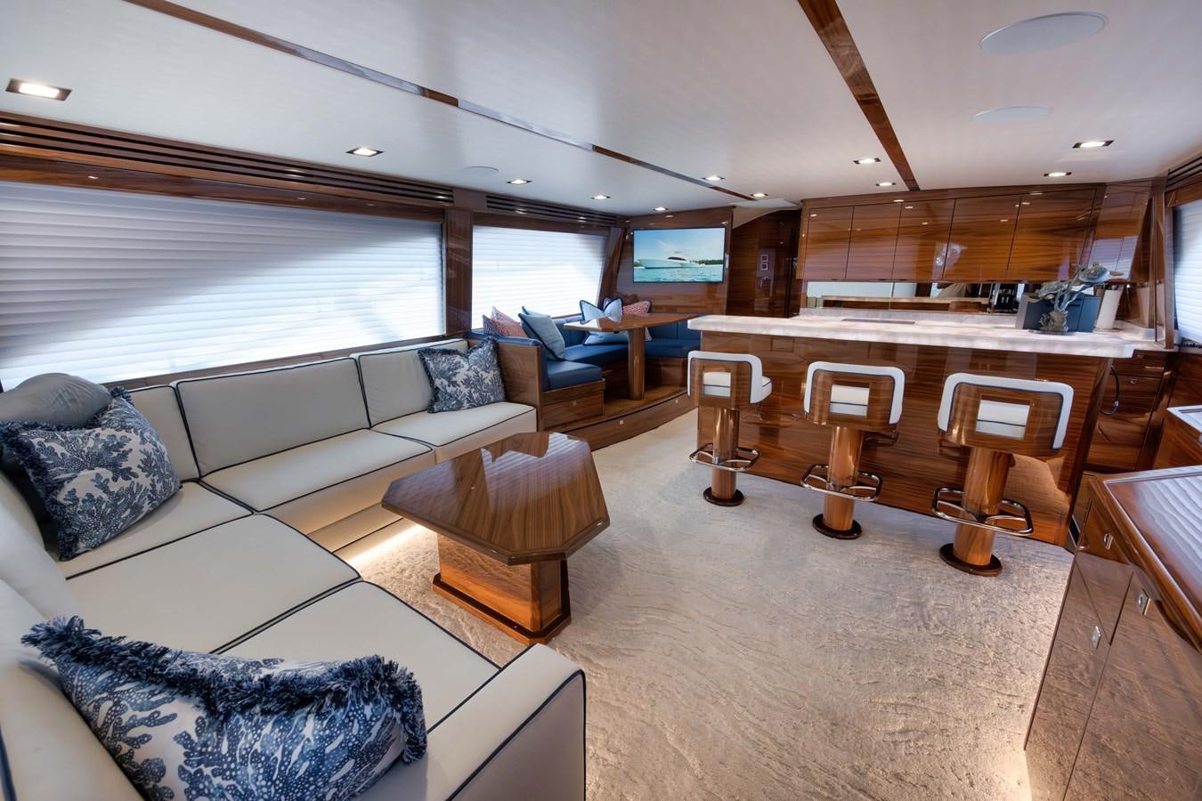 a living room with a large window aboard MISS CARRIE Yacht for Sale