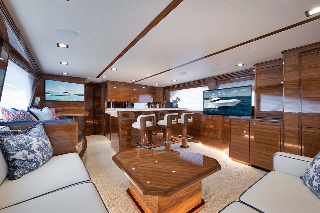 a living room with a large tv aboard MISS CARRIE Yacht for Sale
