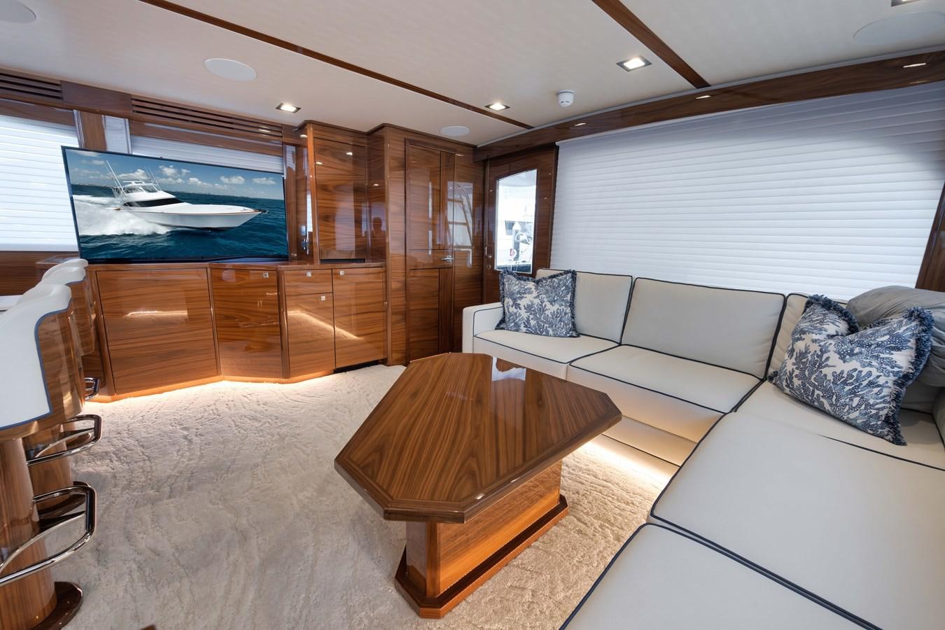 a living room with a couch and a table aboard MISS CARRIE Yacht for Sale