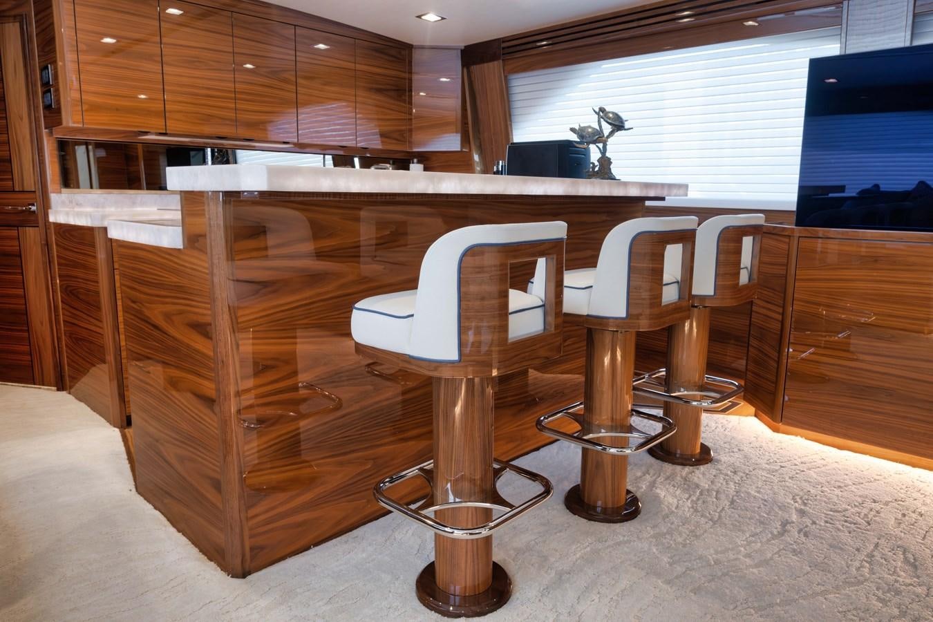 a wooden desk with a chair aboard MISS CARRIE Yacht for Sale