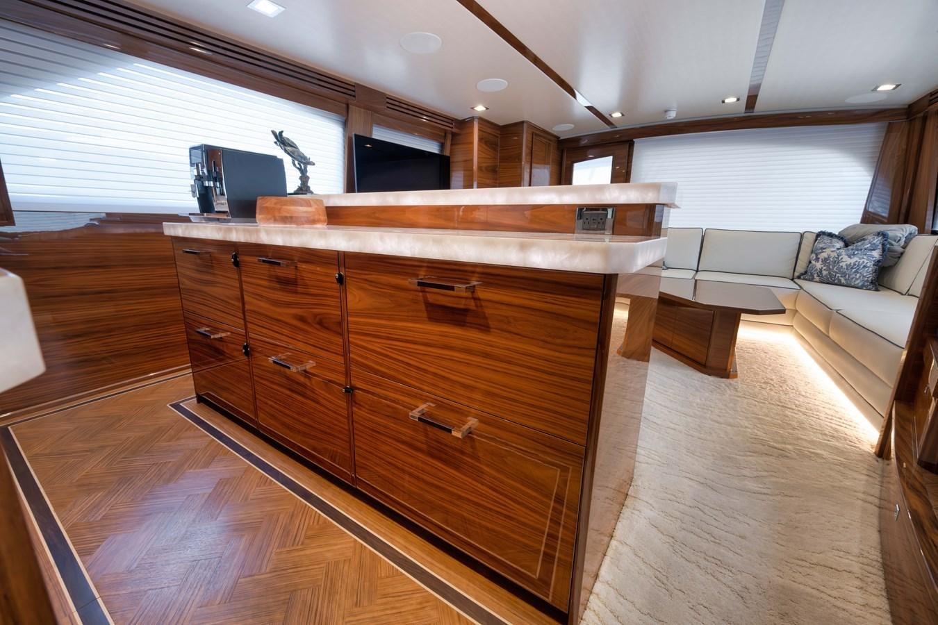 a kitchen with a wood island aboard MISS CARRIE Yacht for Sale