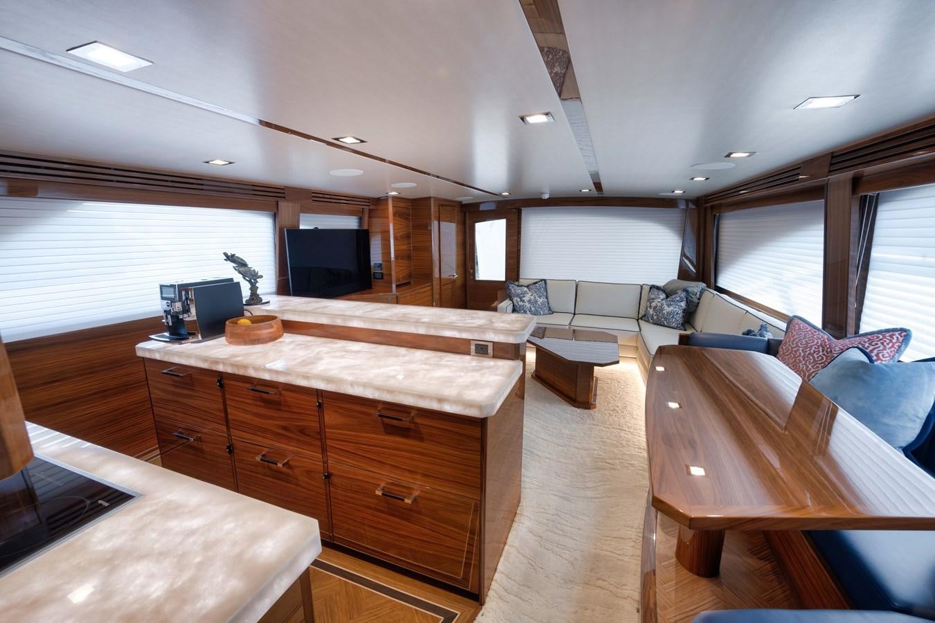 a room with a table and chairs aboard MISS CARRIE Yacht for Sale
