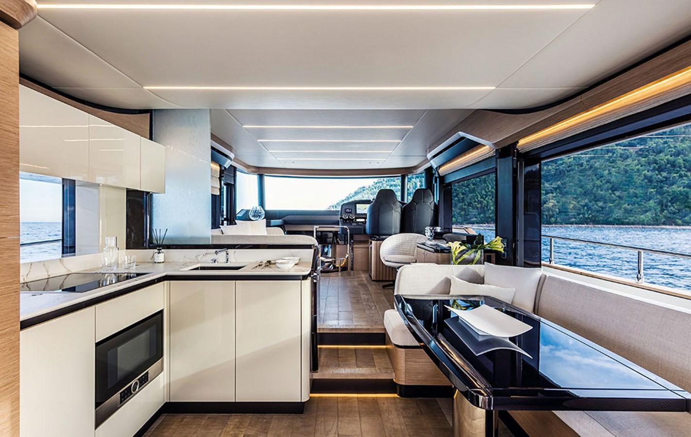 a kitchen with a large window aboard NAVETTA 75 Yacht for Sale