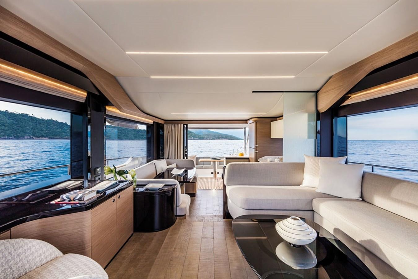 a living room with a large window aboard NAVETTA 75 Yacht for Sale