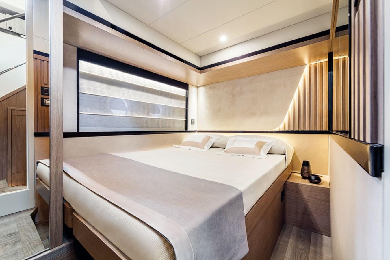 a bed with a white sheet aboard NAVETTA 75 Yacht for Sale
