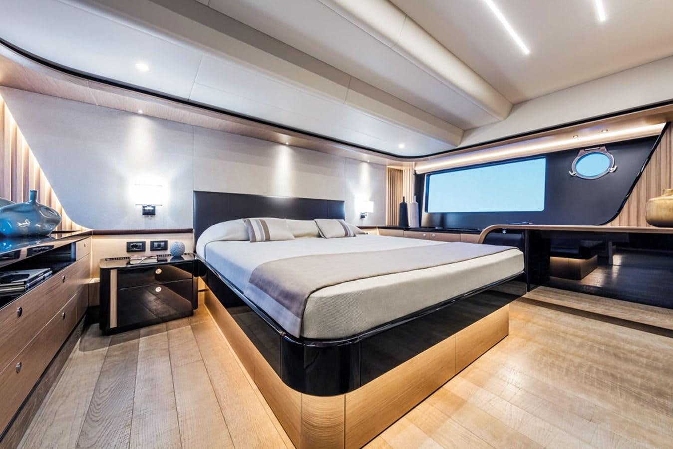 a large bedroom with a large bed aboard NAVETTA 75 Yacht for Sale