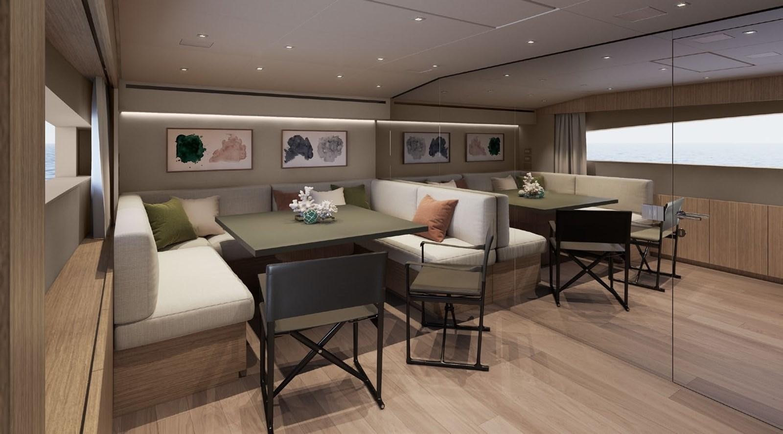 a living room with a couch and a table aboard ALMA BLU Yacht for Sale