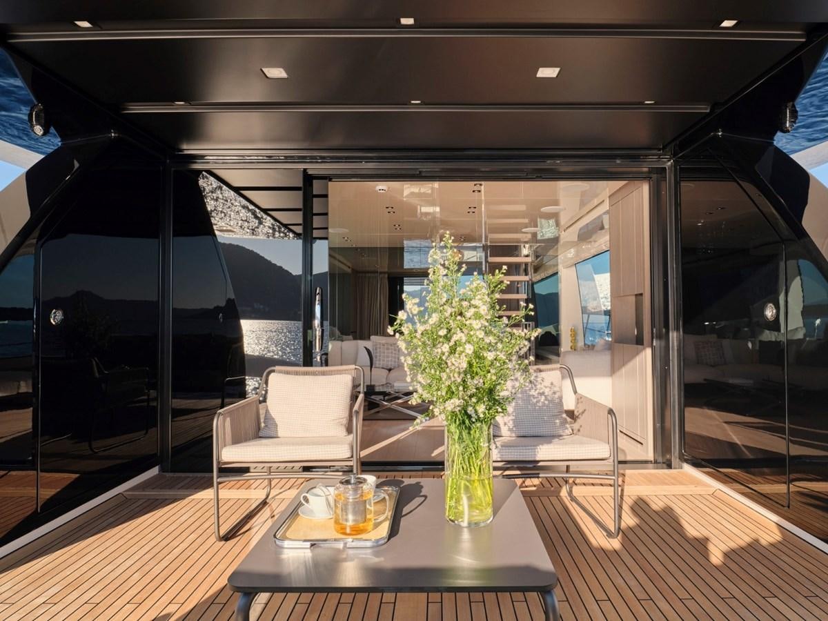 a vase of flowers on a table aboard 2022 SANLORENZO SX76 #72 Yacht for Sale