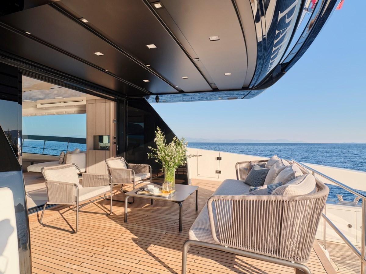 a room with a table and chairs aboard 2022 SANLORENZO SX76 #72 Yacht for Sale