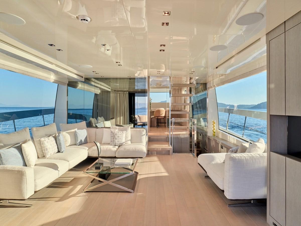 a living room with a large window aboard 2022 SANLORENZO SX76 #72 Yacht for Sale