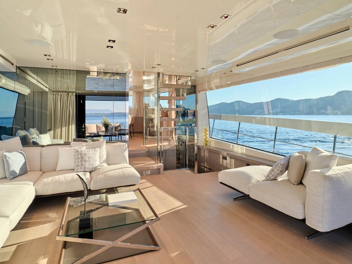 a living room with a large window aboard 2022 SANLORENZO SX76 #72 Yacht for Sale