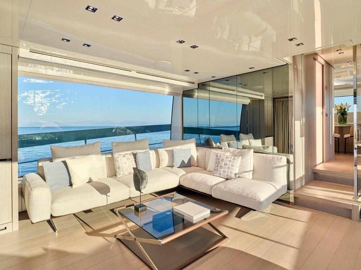 a living room with a large window aboard 2022 SANLORENZO SX76 #72 Yacht for Sale