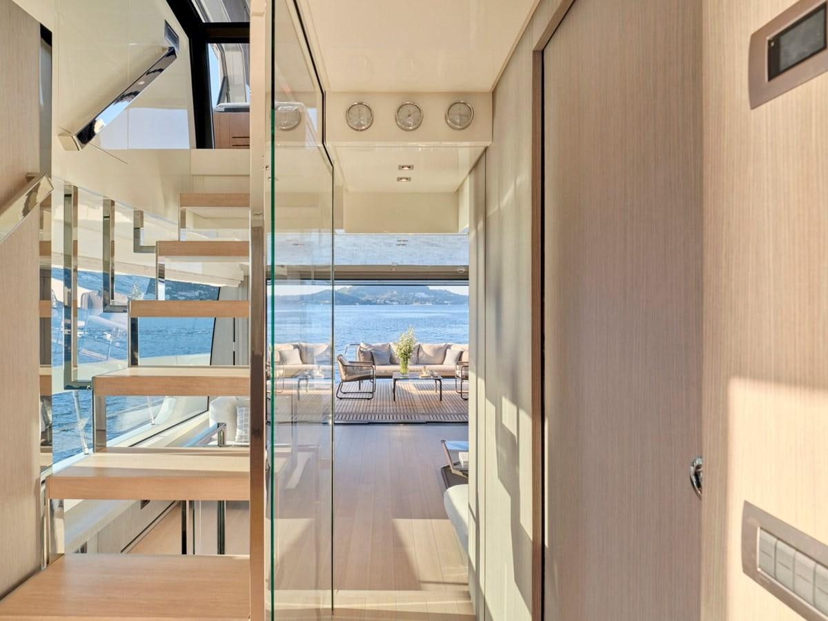 a room with a glass door aboard 2022 SANLORENZO SX76 #72 Yacht for Sale