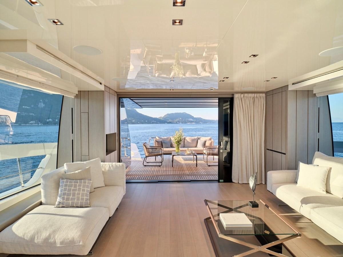 a living room with a large balcony aboard 2022 SANLORENZO SX76 #72 Yacht for Sale