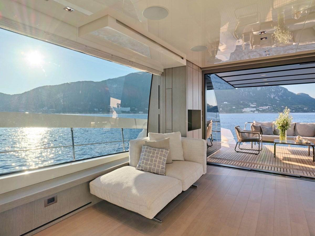 a room with a large window and a view of the water aboard 2022 SANLORENZO SX76 #72 Yacht for Sale
