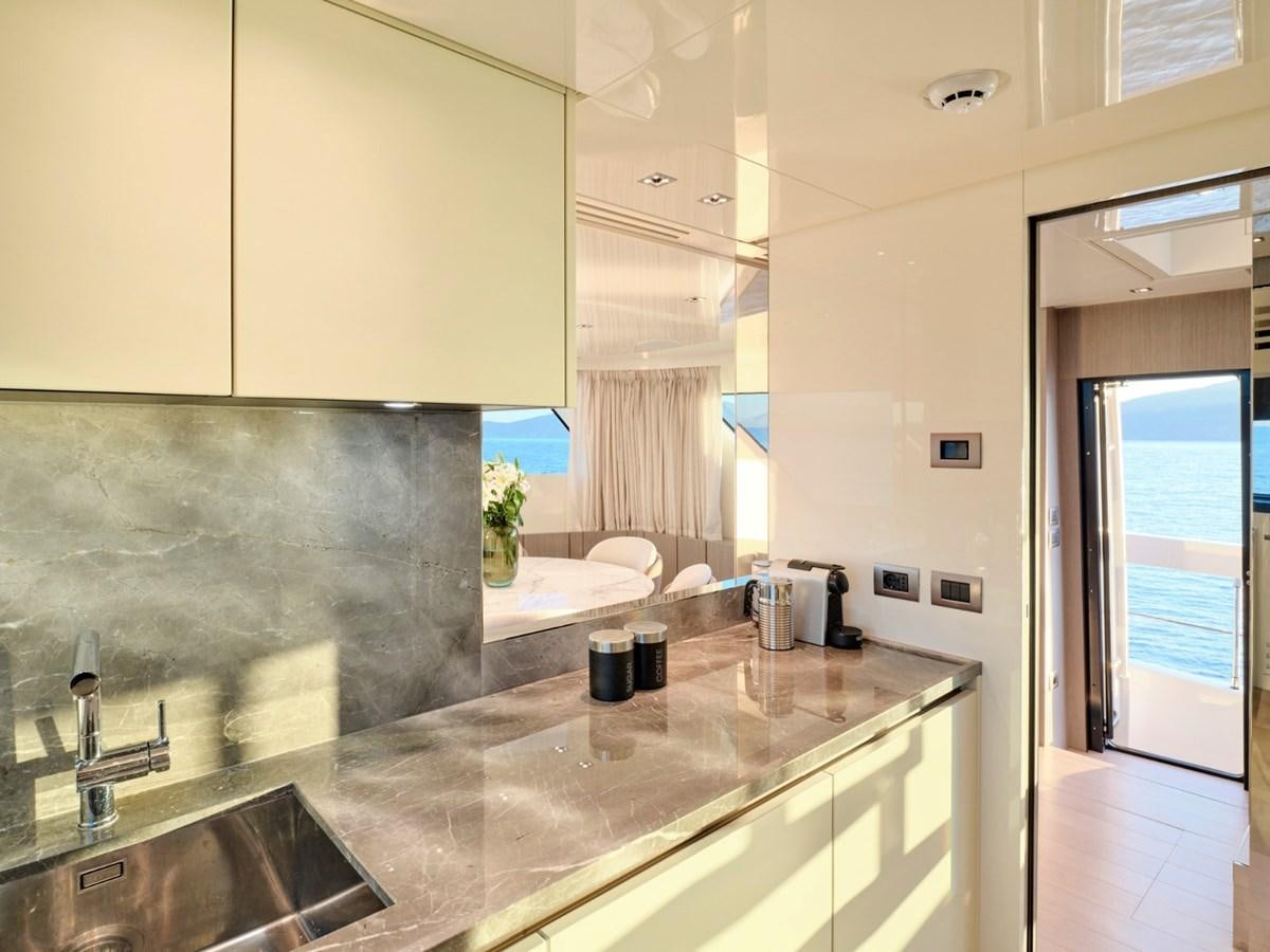 a modern bathroom with marble counter tops aboard 2022 SANLORENZO SX76 #72 Yacht for Sale