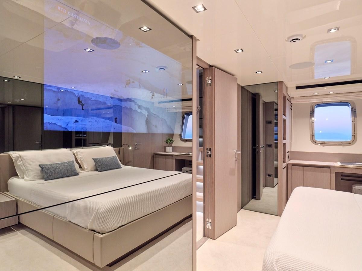 a room with a bed and a window aboard 2022 SANLORENZO SX76 #72 Yacht for Sale