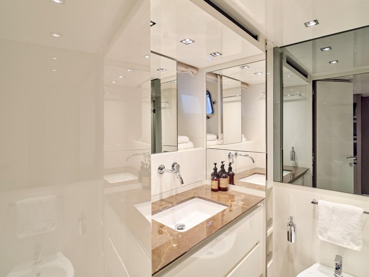 a bathroom with a large mirror aboard 2022 SANLORENZO SX76 #72 Yacht for Sale