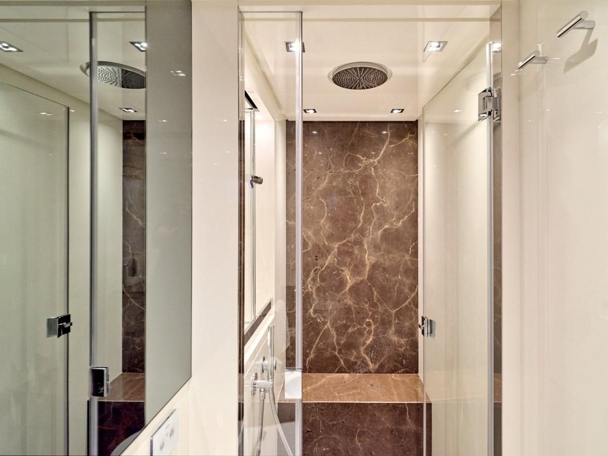 a bathroom with a glass shower aboard 2022 SANLORENZO SX76 #72 Yacht for Sale