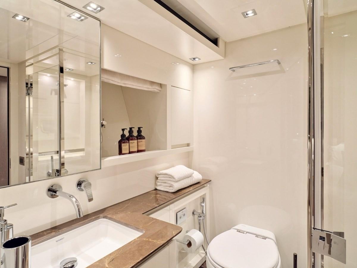 a bathroom with a sink and a mirror aboard 2022 SANLORENZO SX76 #72 Yacht for Sale