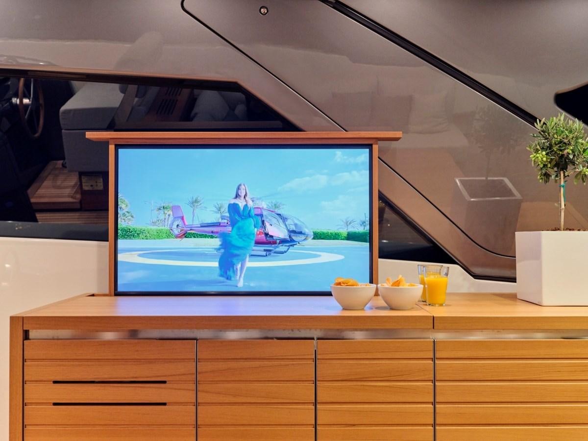 a tv on a stand aboard 2022 SANLORENZO SX76 #72 Yacht for Sale