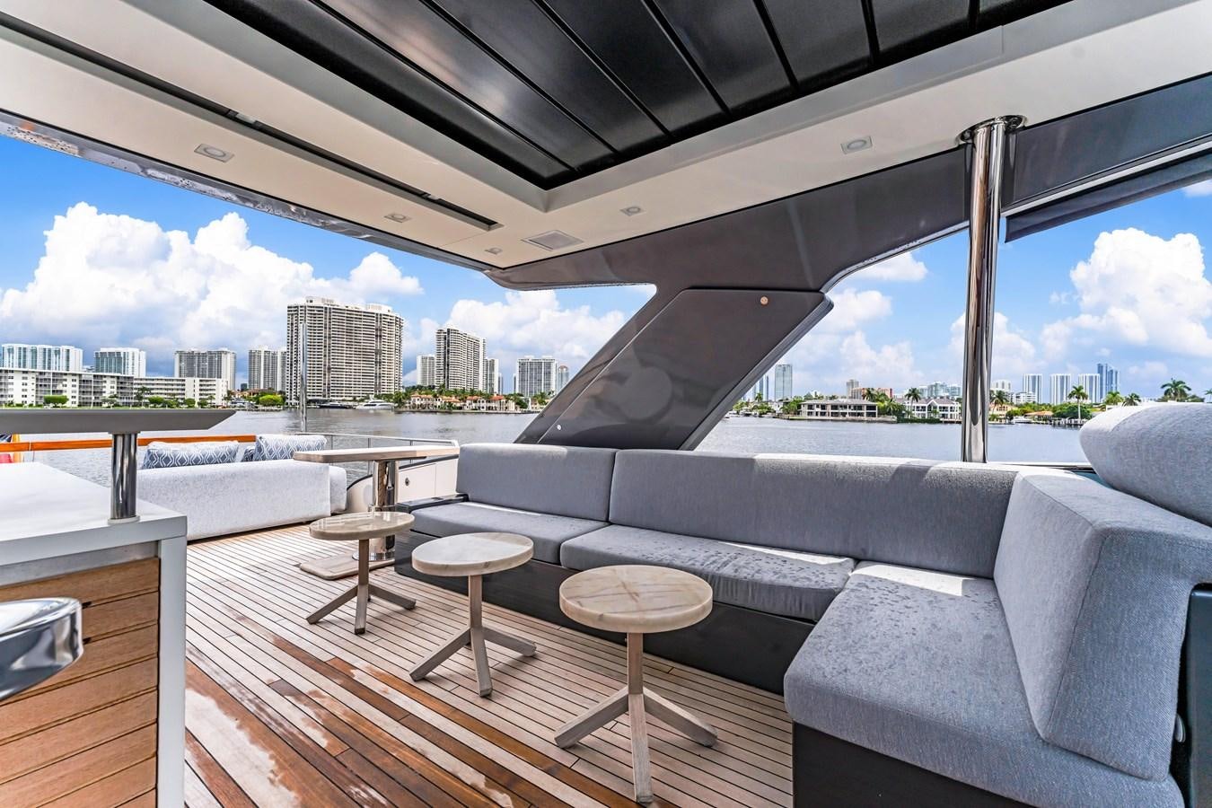 a room with couches and a table and a view of a city aboard 2018 SANLORENZO SL78 Yacht for Sale