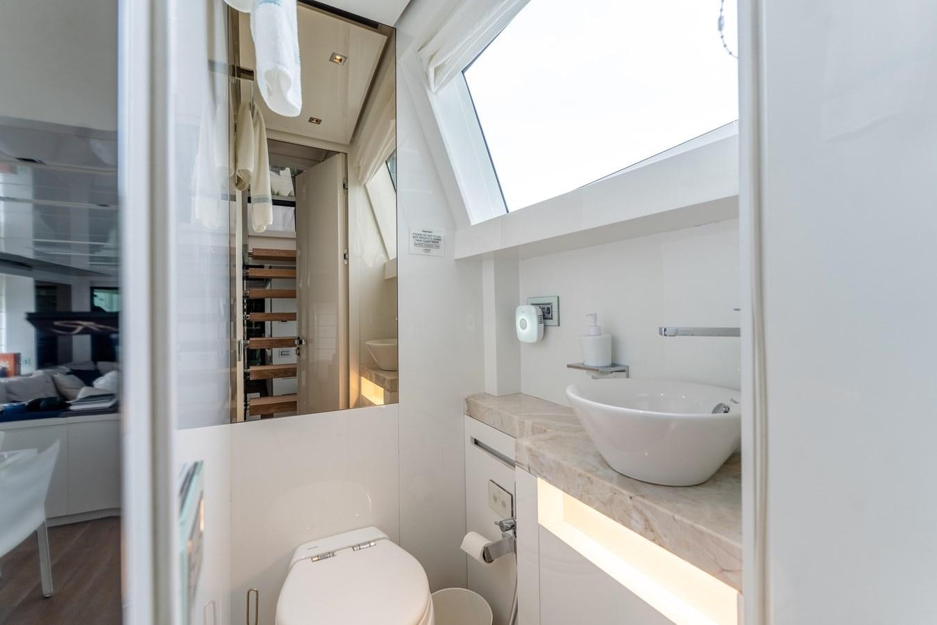 a bathroom with a sink and a mirror aboard 2018 SANLORENZO SL78 Yacht for Sale