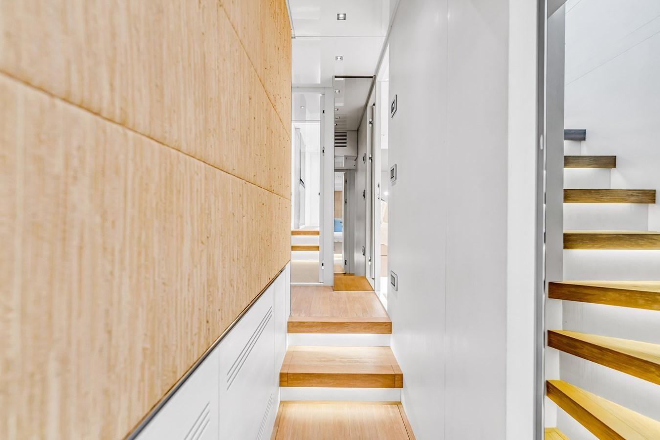 a hallway with white cabinets aboard 2018 SANLORENZO SL78 Yacht for Sale