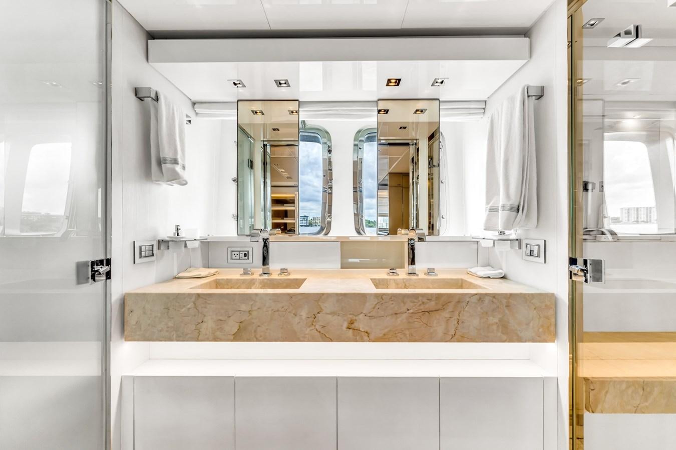 a bathroom with a large mirror aboard 2018 SANLORENZO SL78 Yacht for Sale