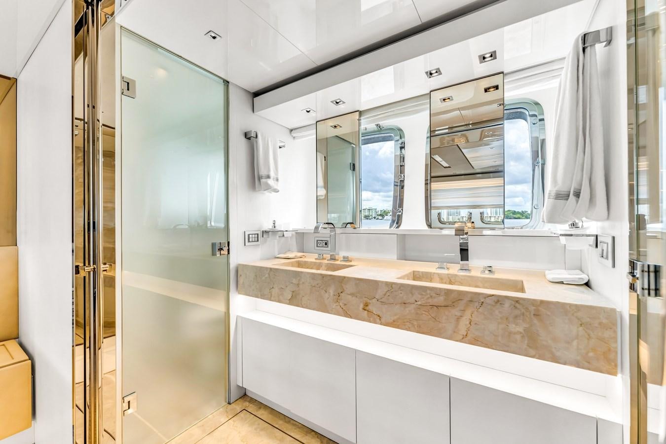 a bathroom with a large mirror aboard 2018 SANLORENZO SL78 Yacht for Sale