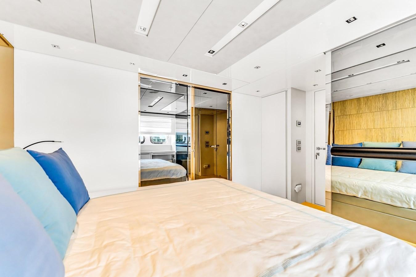 a room with a bed and a desk aboard 2018 SANLORENZO SL78 Yacht for Sale