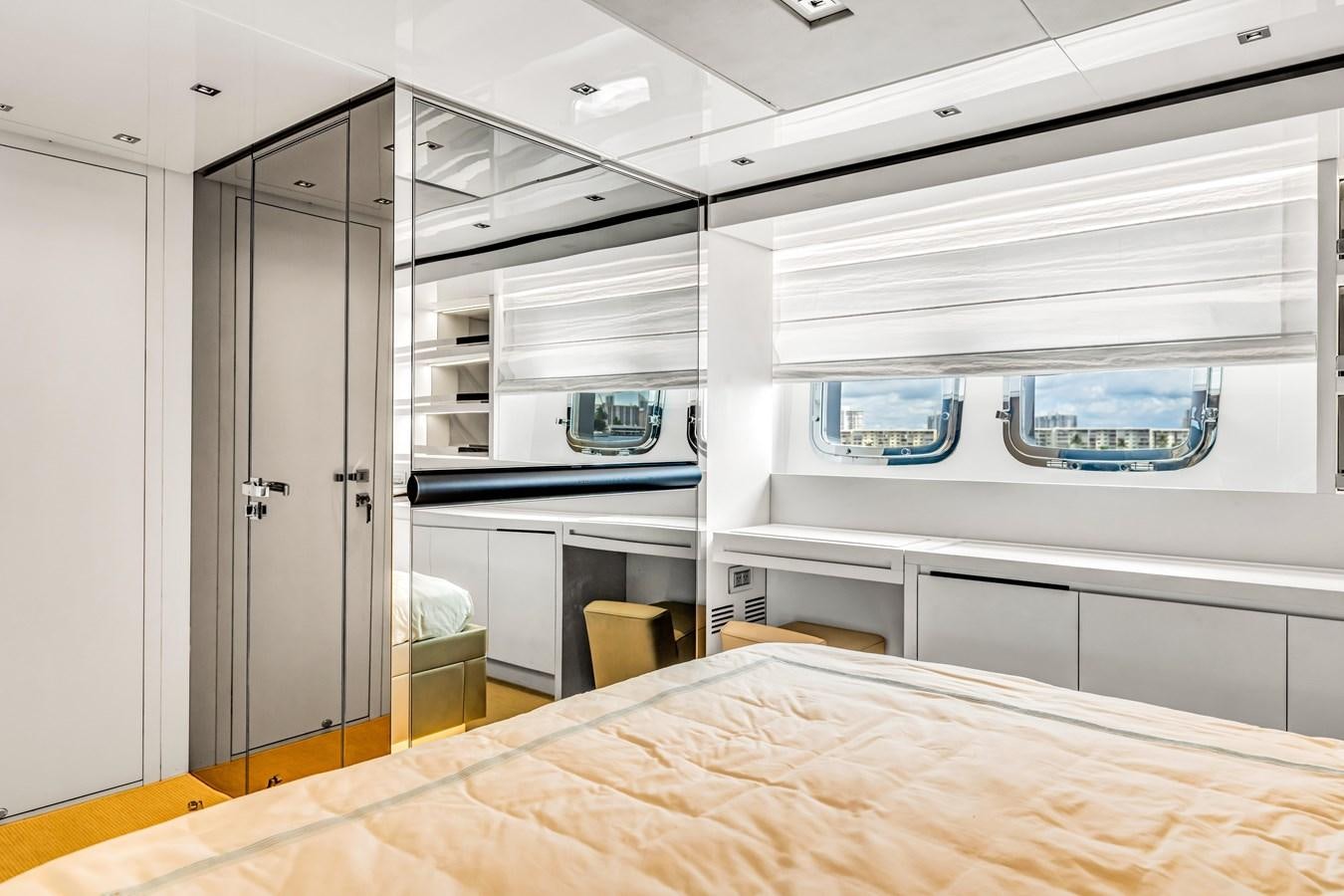a room with a bed and a desk aboard 2018 SANLORENZO SL78 Yacht for Sale