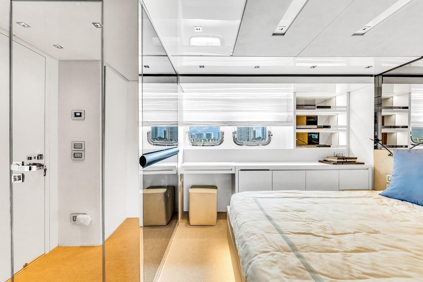 a room with a bed and a desk aboard 2018 SANLORENZO SL78 Yacht for Sale