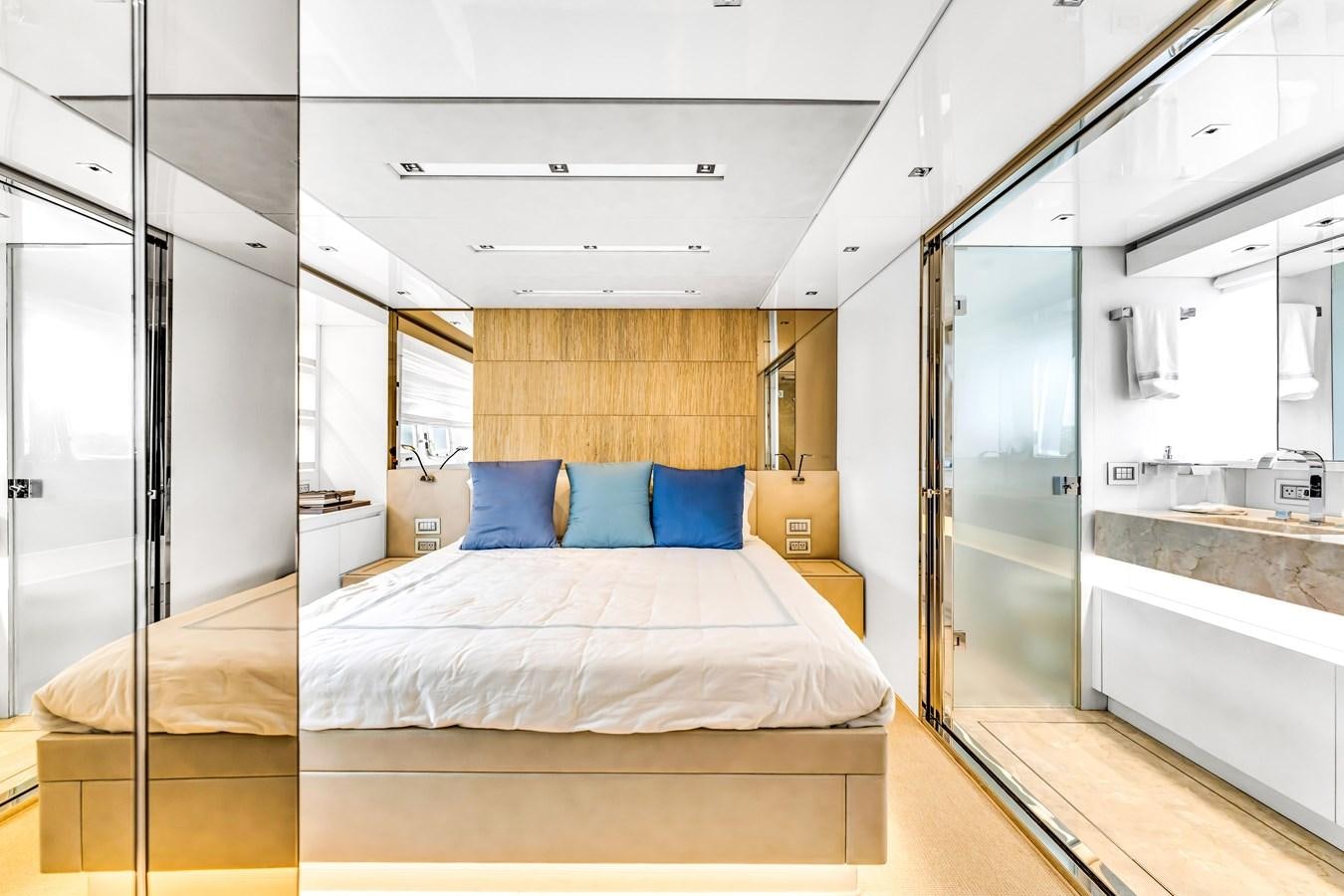 a room with a bed and a mirror aboard 2018 SANLORENZO SL78 Yacht for Sale