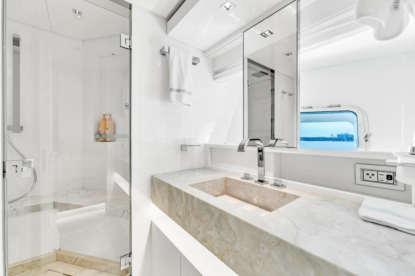a bathroom with a sink and a mirror aboard 2018 SANLORENZO SL78 Yacht for Sale
