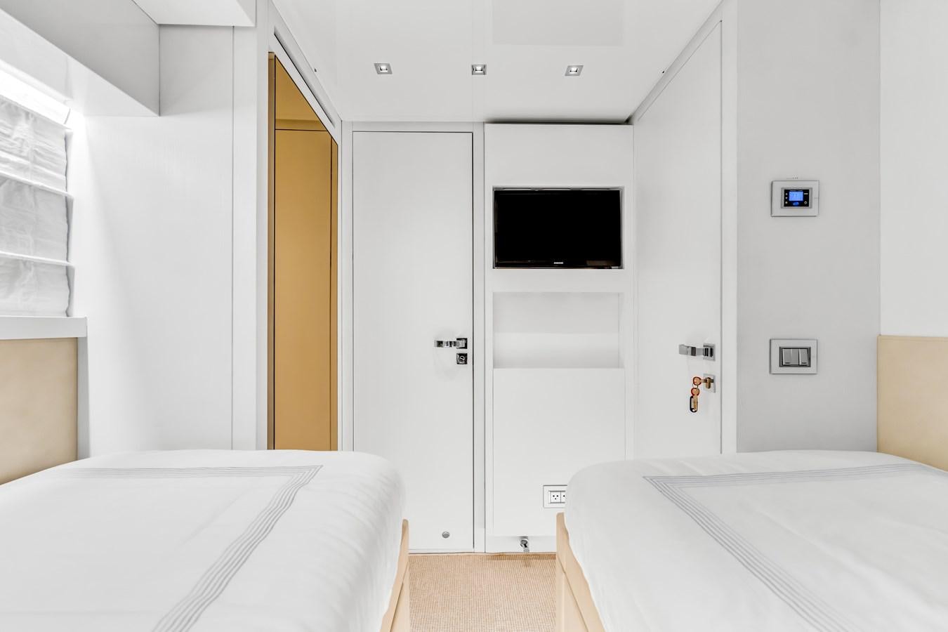 a room with a bed and a television aboard 2018 SANLORENZO SL78 Yacht for Sale