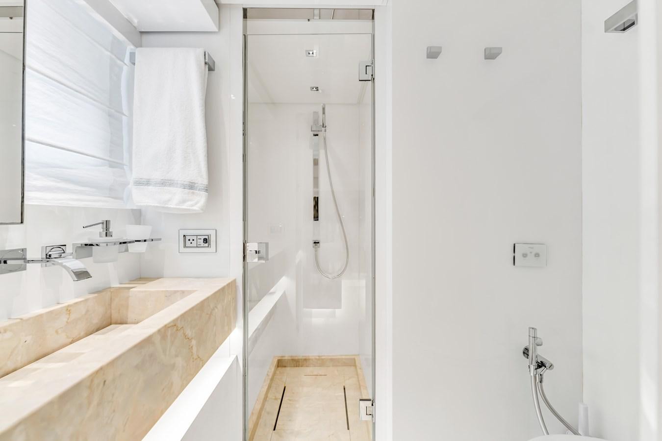 a bathroom with a tub sink and shower aboard 2018 SANLORENZO SL78 Yacht for Sale