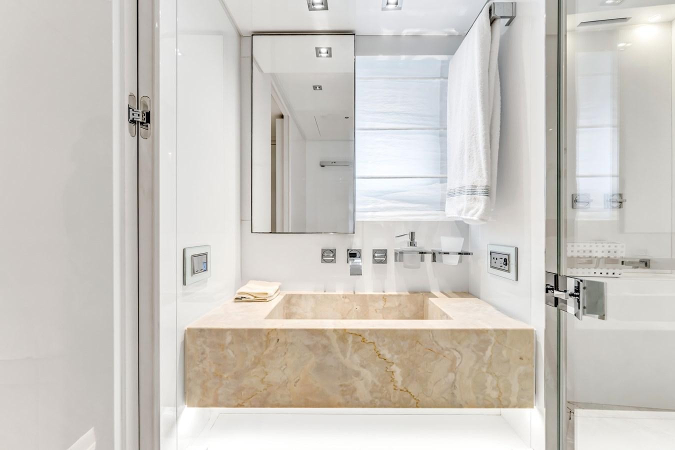 a bathroom with a countertop sink and mirror aboard 2018 SANLORENZO SL78 Yacht for Sale
