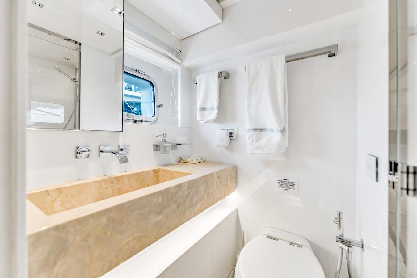 a bathroom with a sink and a toilet aboard 2018 SANLORENZO SL78 Yacht for Sale