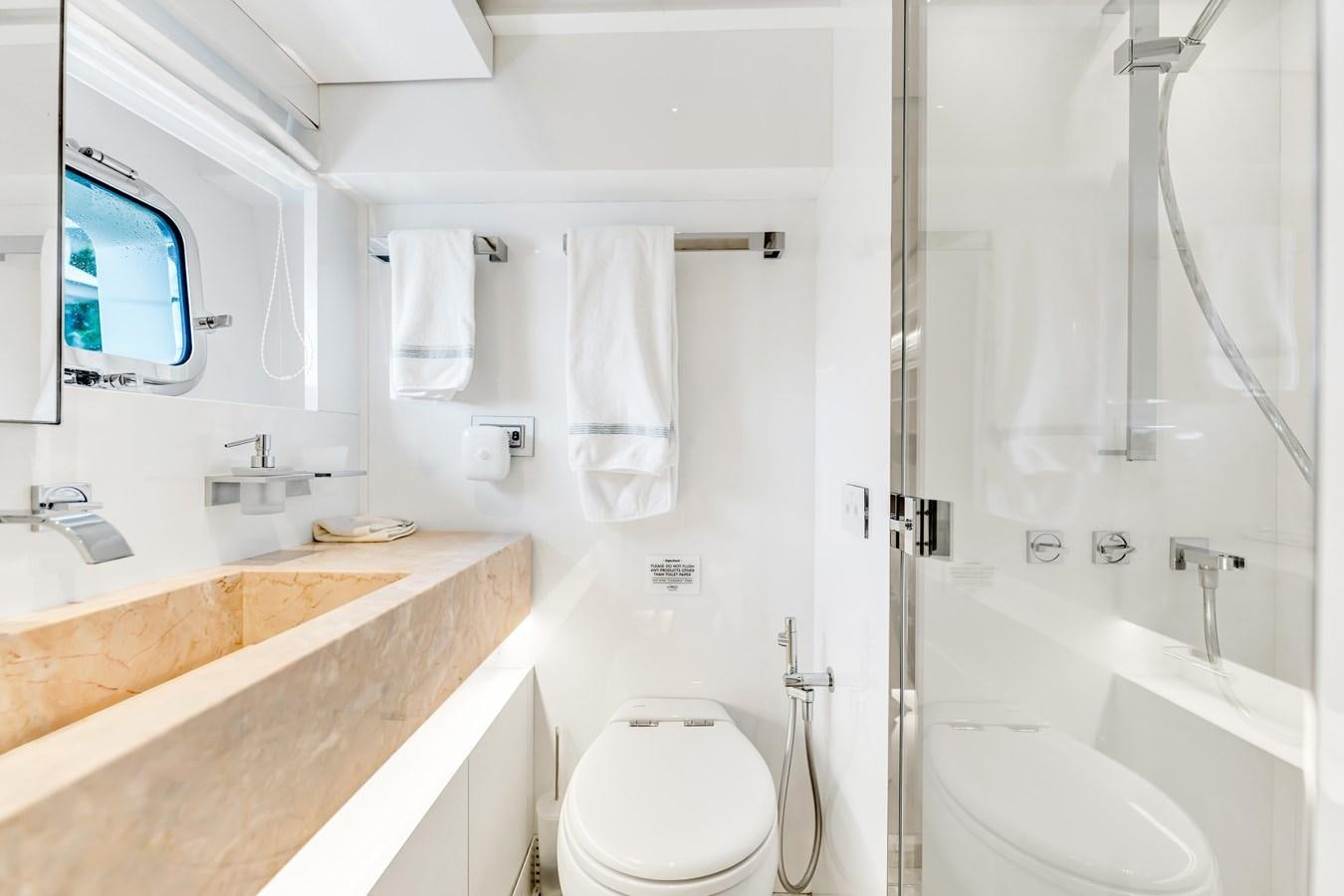 a bathroom with a tub sink and toilet aboard 2018 SANLORENZO SL78 Yacht for Sale